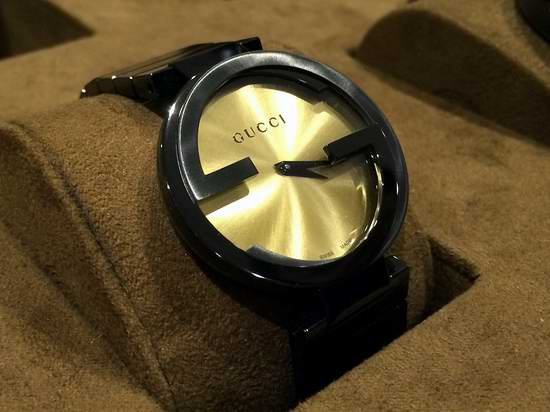 02-721_4a0df0d6-39d4-4e41-89b0-762257d93f68 Gucci Interlocking Grammy XL Gold Dial Black Steel Strap Watch for Men - YA133209