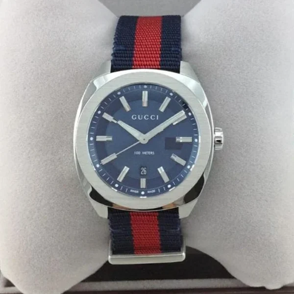 1147e9af380242ac110004-197937_db8a3548-0ac8-47fc-8916-490564a2437b Gucci GG2570 Quartz Blue Dial Blue & Red Nylon Strap Watch For Men - YA142304