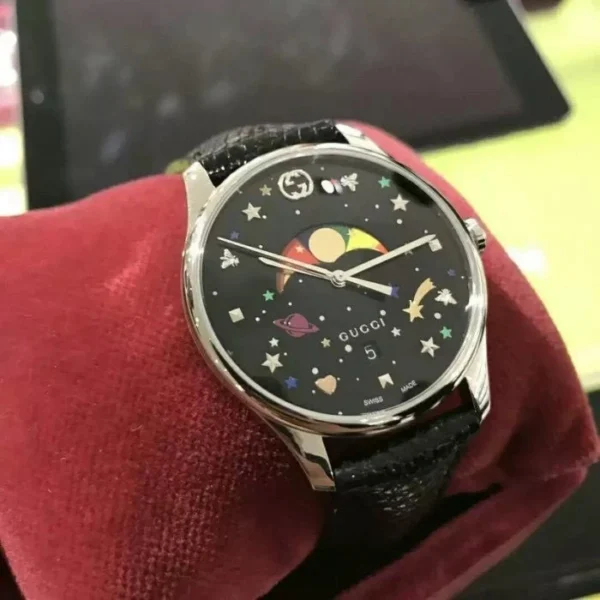 3b5ef7a31a282c16865c6ef1ec88b366-156829_1aeed54b-5629-4c8c-a2b6-04f7827f63b3 Gucci G-Timeless Moonphase Black Dial Black Leather Strap Watch For Men - YA1264045