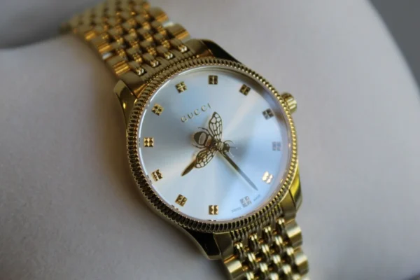 4e6f30ad-bed3-4131-a9f8-ac8d8fef8228 Gucci G Timeless Mother of Pearl Dial Gold Steel Strap Watch For Women - YA1265021