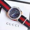 598e0083a5511a946032d3fdc72a37ef-873924_c76e8741-3930-4fcc-beaa-e7f30f41bde4 Gucci GG2570 Quartz Blue Dial Blue & Red Nylon Strap Watch For Men - YA142304