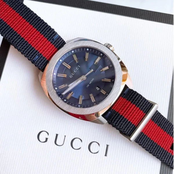 598e0083a5511a946032d3fdc72a37ef-873924_c76e8741-3930-4fcc-beaa-e7f30f41bde4 Gucci GG2570 Quartz Blue Dial Blue & Red Nylon Strap Watch For Men - YA142304