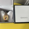 5bb8f124-dfca-426f-8754-dd99d419a4cc_b60e8edc-e370-4aab-b646-2fc1cb6abc04 Gucci Grip Disney Mickey Mouse Gold Dial Brown Leather Strap Watch For Women - YA157420