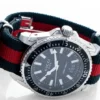 Gucci-Dive-YA136206_2-484158_7d693c9d-05c3-4aba-bb3a-00937628e803 Gucci Dive Black Dial Two Tone NATO Strap Watch For Men - YA136206