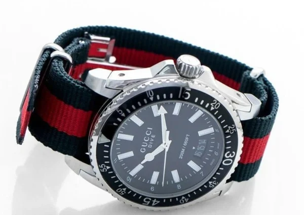 Gucci-Dive-YA136206_2-484158_7d693c9d-05c3-4aba-bb3a-00937628e803 Gucci Dive Black Dial Two Tone NATO Strap Watch For Men - YA136206