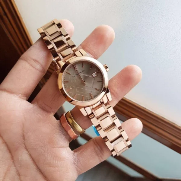 burberrythe-city-bu9135-34mm-965341_a9d0fb18-c903-4570-81dc-1d7298af8f92 Burberry The City Nude Dial Rose Gold Steel Strap Watch for Women - BU9228