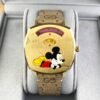 i-img1200x1200-1692351982ihgoxn135755_19dd1d68-4e48-4554-b631-95c181026e2b Gucci Grip Disney Mickey Mouse Gold Dial Brown Leather Strap Watch For Women - YA157420