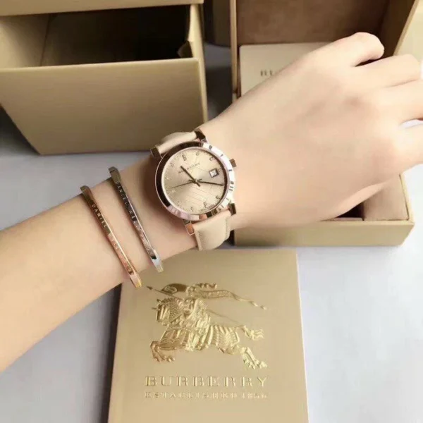 s-l1600_72fadfaf-35fb-455c-b408-5a5f9b83485d-134799 Burberry The City Diamonds Gold Dial Beige Leather Strap Watch for Women - BU9131